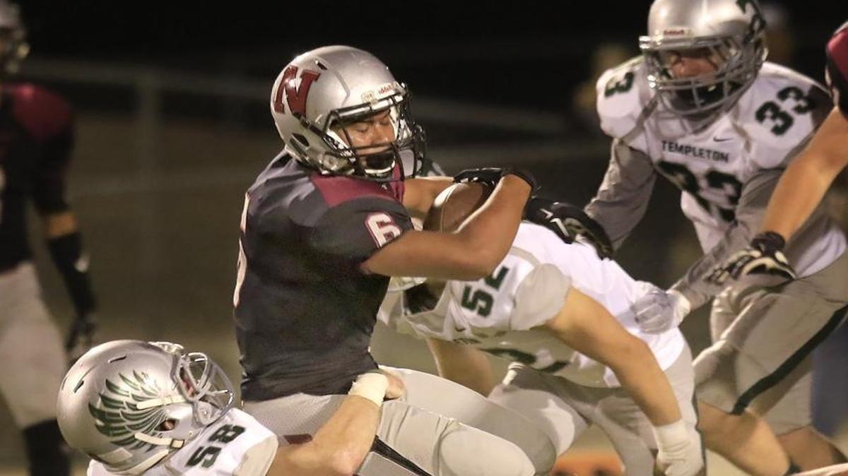 Nipomo hosts Templeton at Nipomo High School in a Northern League game, Friday, October 7. Nipomo’s Isaac Bausley (6) gets tackles by Templeton’s Austin Jones (58).