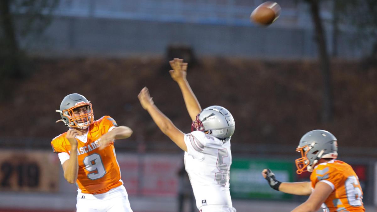 Evan Moscardi completes a pass under pressure from Moses Soto-Mesa. Atascadero hosted Torres of Madera to open the football season with a non-league matchup.