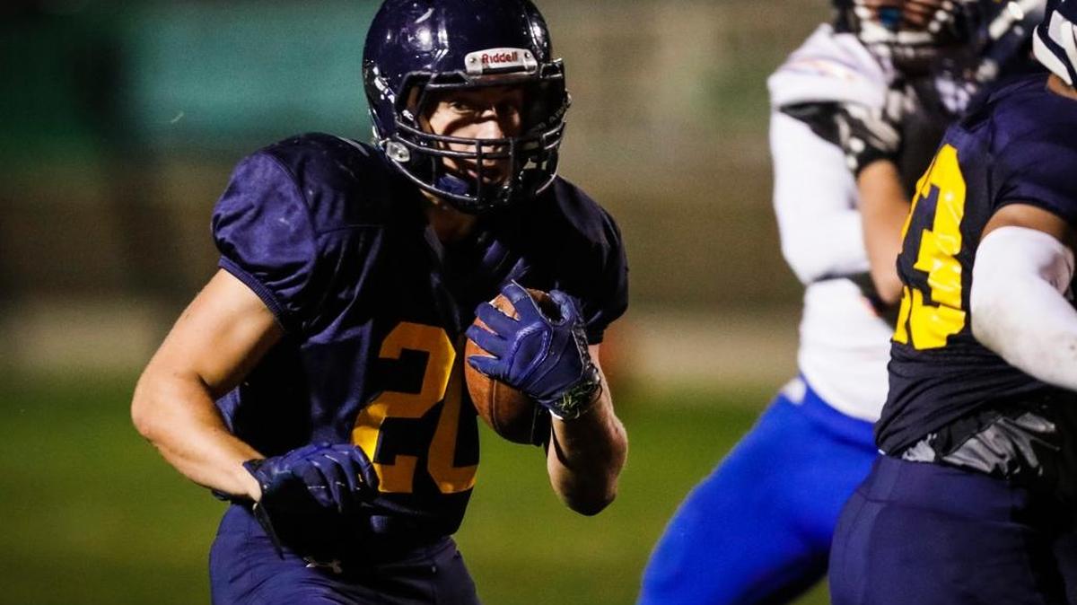James Gilmet hits the hole as Arroyo Grande High hosts Westlake in the first round of the CIF-Southern Section Division 2 playoffs.