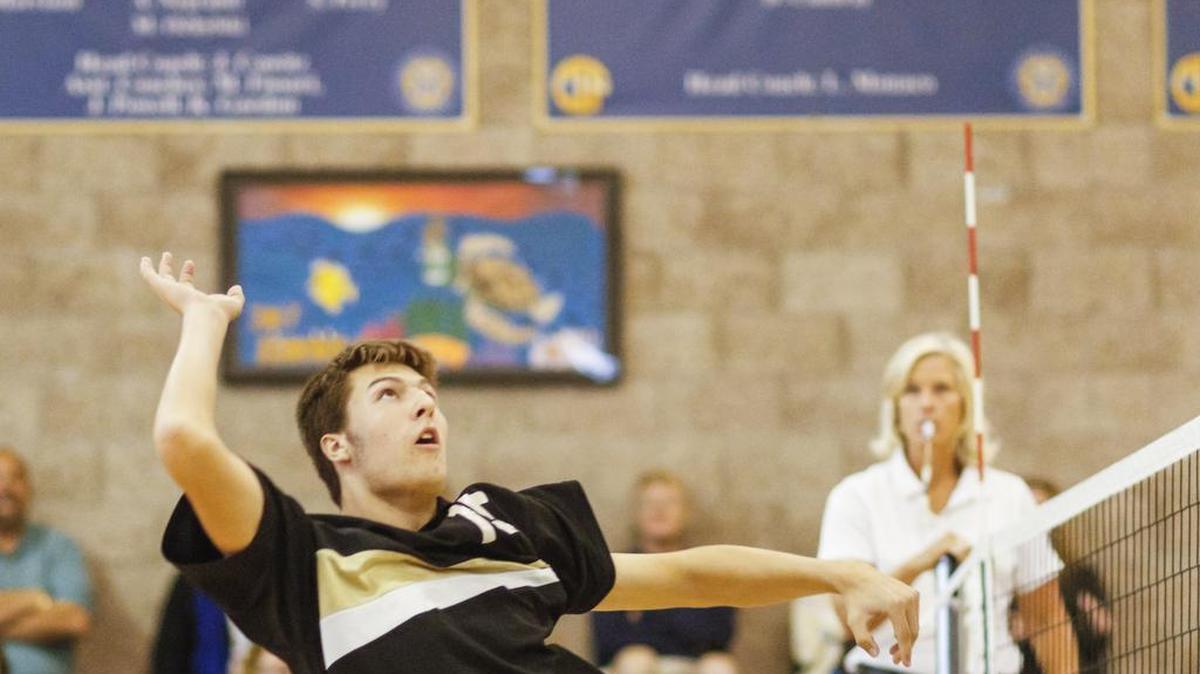 San Luis Obispo High’s Nick Attala hits a kill attempt during the Tigers’ win over Mission Prep in a PAC 8 showdown.