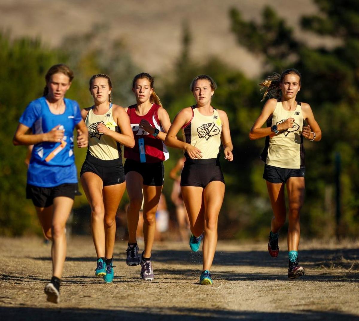 Three members of the SLO High cross country team compete at the San Luis Obispo County cross country meet at Laguna Lake Park. Photo by Joe Johnston 10-26-17