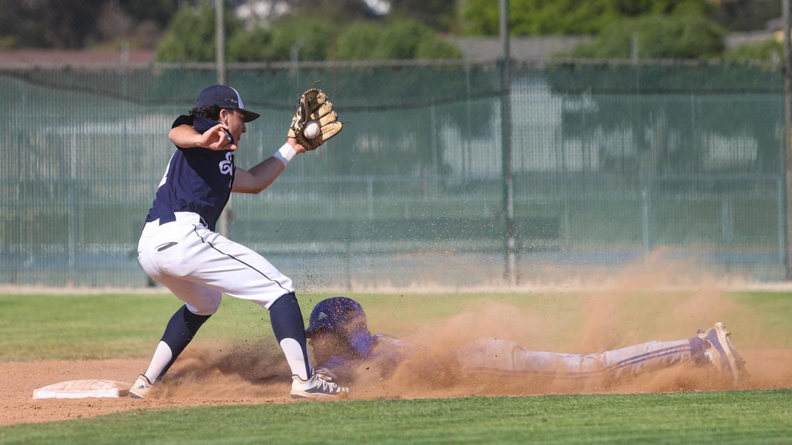 Shortstop Drew Baskin takes a throw as Logan Wattenbarger steals second. Arroyo Grande hosted Madera in the CIF Division 2-Central Section Championship.