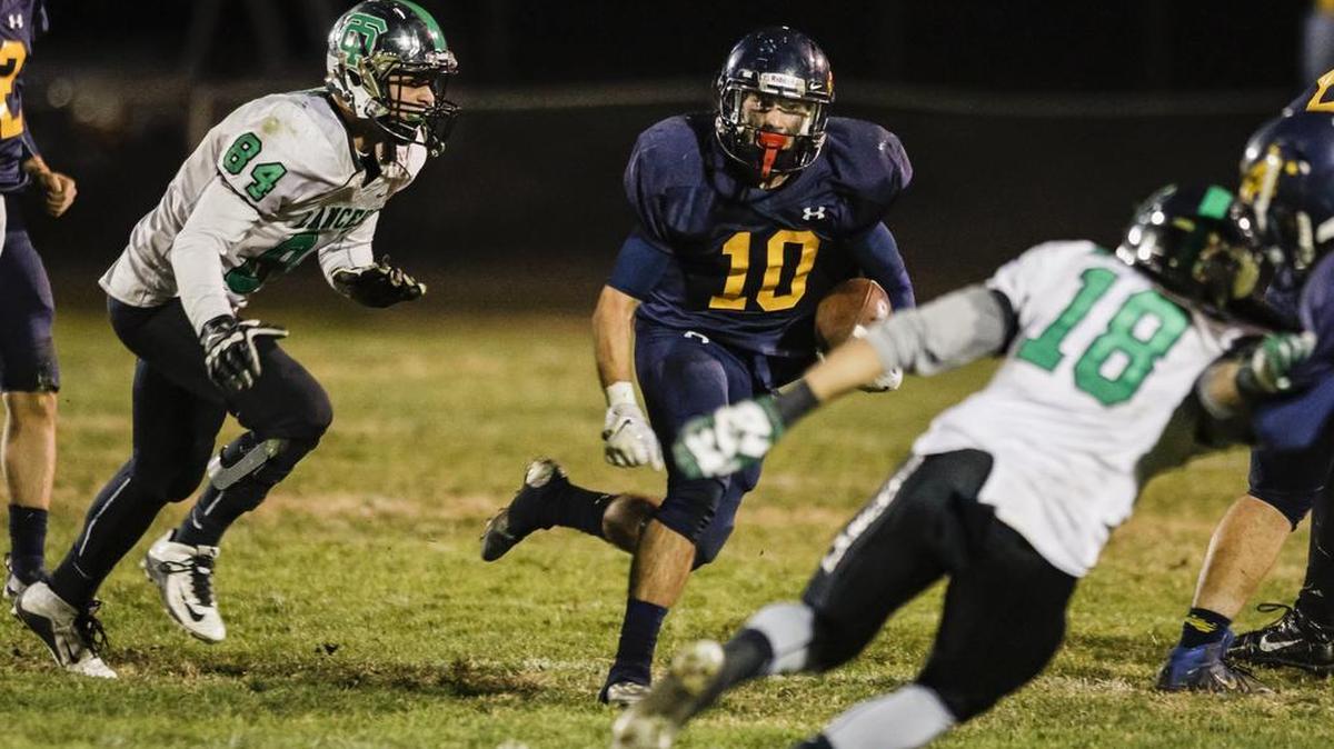 Arroyo Grande High’s Alex Cecchi looks for running room during the Eagles’ playoff loss to Thousand Oaks on Friday night.