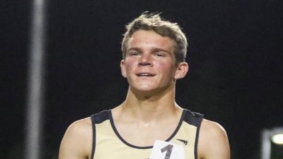 SLO High senior Callum Bolger receives his first-place medal alongside Cooper Teare (left) and Luis Grijalva at the CIF State Track and Field Finals at Buchanan High School in Clovis after winning the 3200-meter event.