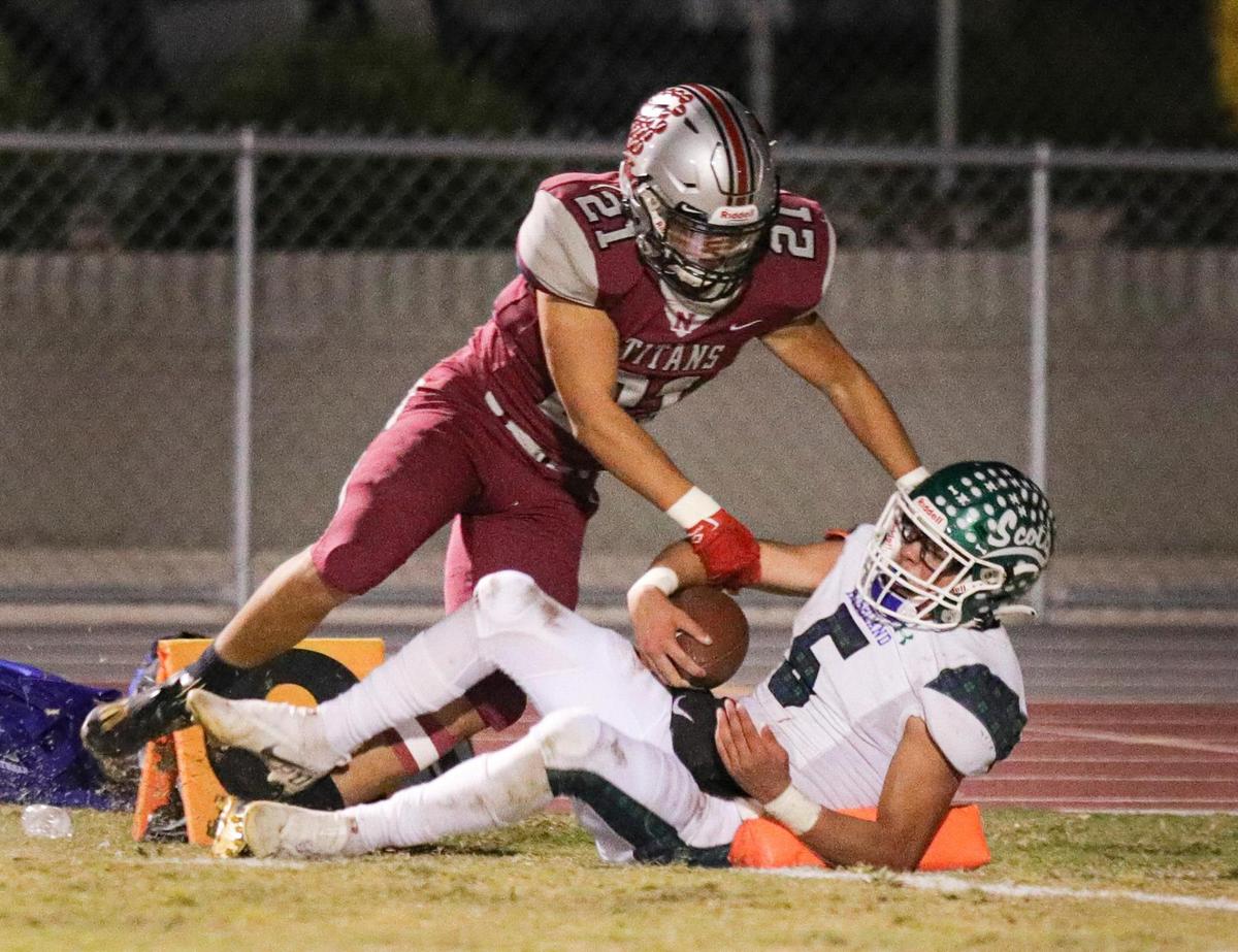 Highland’s Jojo Mata scores despite the tackle by Nipomo’s Alex Terrones. Nipomo fell to Highland 13-12 in the CIF-Central Section football playoffs on Nov. 12, 2021.