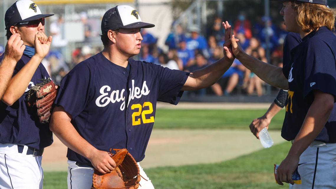 Carson Gomes comes off the mound to congratulations for closing out in an inning. Cal Poly’s Orfla College of Business had the first graduation ceremony on Saturday.