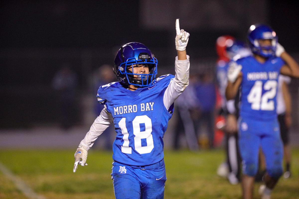 The Pirates’ Johnny Botello celebrates the interception that sealed the win over Pioneer Valley. Morro Bay advanced to the finals with a 29-26 victory in the CIF-Central Section semifinal football game on Nov. 19, 2021.