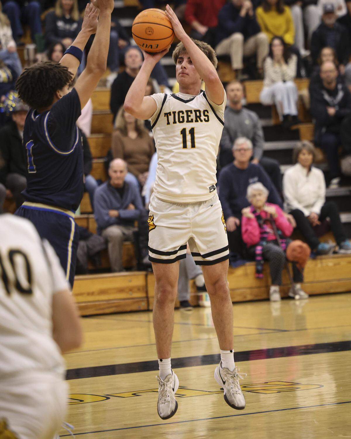 Beau Crew takes a shot as Hunter Drake closes in.  Mission Prep boys beat San Luis Obispo High School 69-53 in a basketball game on Feb. 10, 2026. 