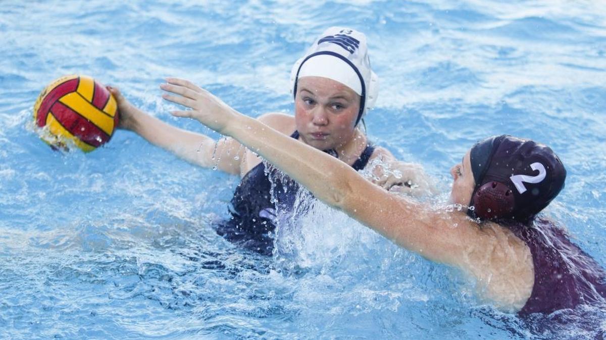 Sarah Parson of Arroyo Grande High School shoots around Makenna Pugh of Paso Robles. Paso Robles hosted Arroyo Grande in a girls high school water polo match.
