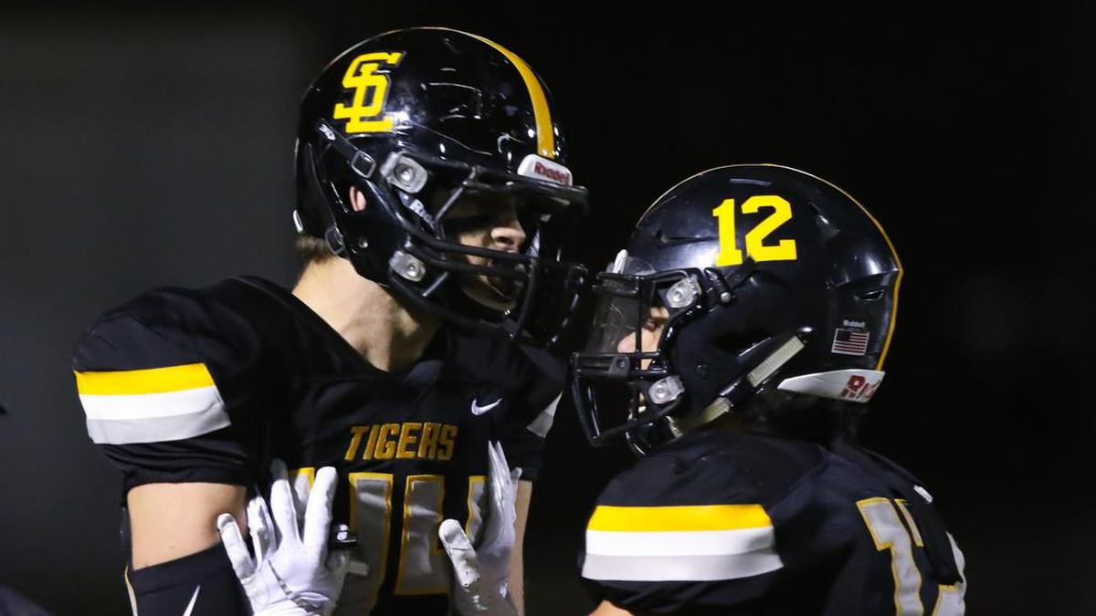 Carson Leedom (44) celebrates a touchdown catch with Max Soltero (12). San Luis Obispo High School beat Madera 49-28 to advance to the CIF-Central Section Division 3 semifinals.
