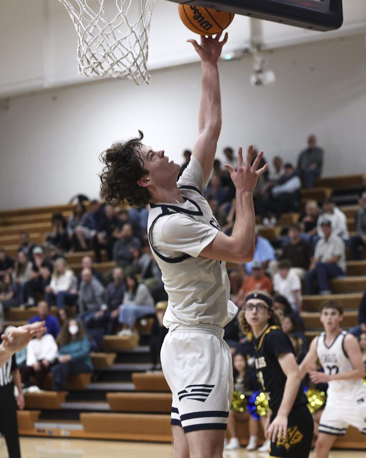Jagger Young shoots a reverse layup. San Luis Obispo High School boy's basketball team beat Arroyo Grande 52-45 on Feb. 3, 2026.