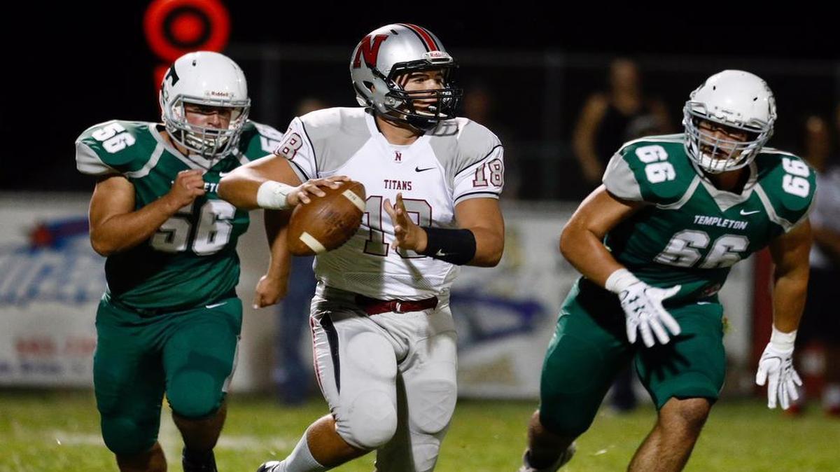Templeton’s Austin Domingos (56) and Colton Boronda (66) pursue Nipomo sophomore quarterback Brayden Groshart in the teams’ Northern League opener Friday night in Templeton.
