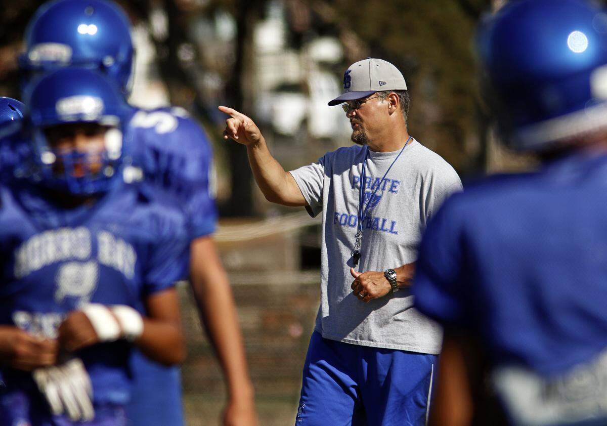 Head coach David Kelley leads a practice at Morro Bay High School football in 2015. He was removed from the job after using language insensitive to the LGBTQ community on Oct. 24.