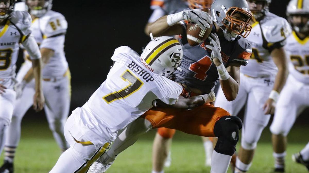 Atascadero High School football hosts St. Francis in a non-league game. Elijah Cooks is stopped by Tre'Sean Bishop.