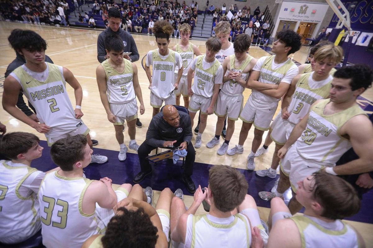 Head coach Terrance Harris had some points to make with his team during a time out in the second half. Mission Prep overcame a first half deficit to finish with a win over Hoover of Fresno, 67-56 in a high school basketball playoff Feb. 20, 2024.