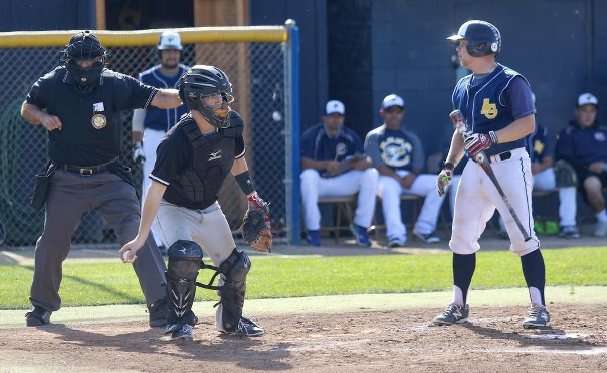 A negotiation to increase umpire pay for Central Coast high school baseball has ended and schools are looking to use out-of-area umps. Here, Nash Ackerman of Arroyo Grande High looks at the umpire as he calls strike 3 to end the inning (2016 photo).