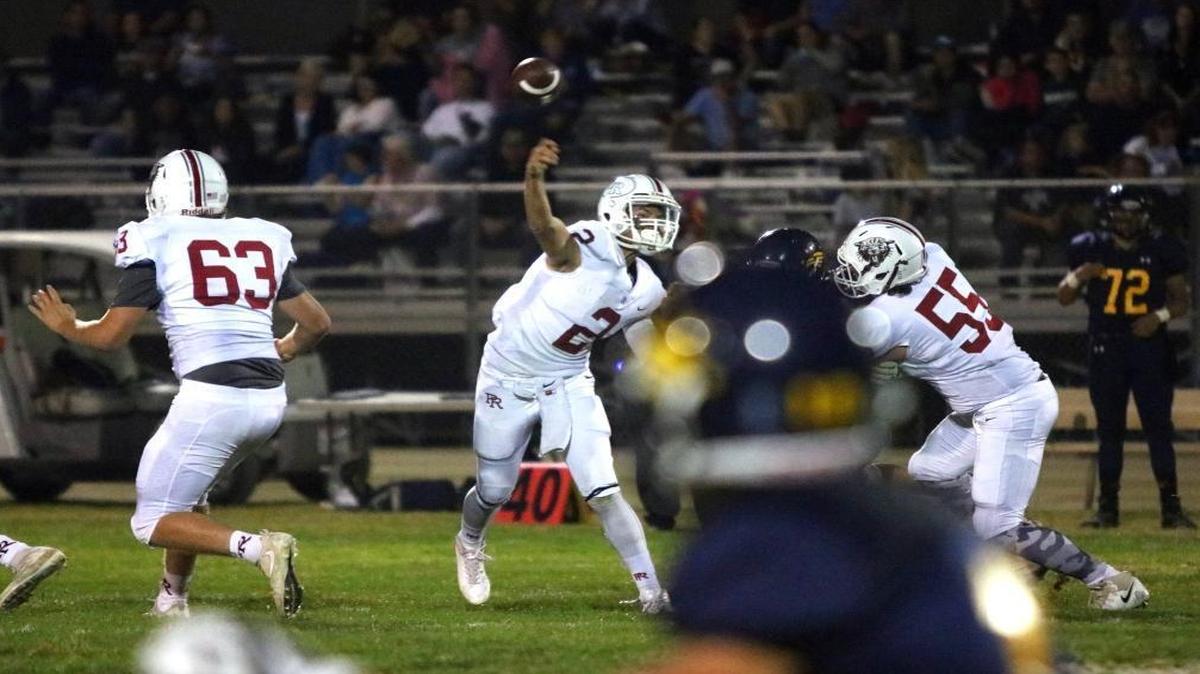 Paso Robles sophomore quarterback Hunter Barnhart completes a pass in the first quarter against Arroyo Grande.