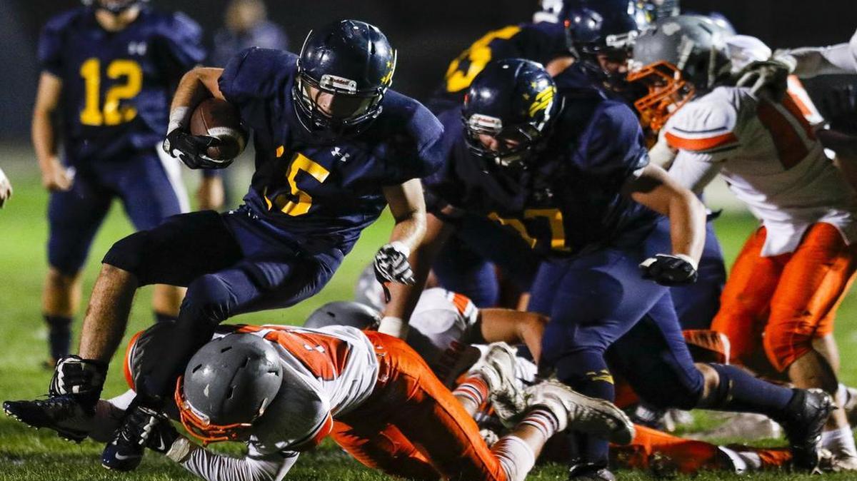Arroyo Grande hosted Atascadero in high school football. Noah Thinger takes hand off from Sawyer May before being tripped up just short of the goal line. 10-28-2016 David Middlecamp