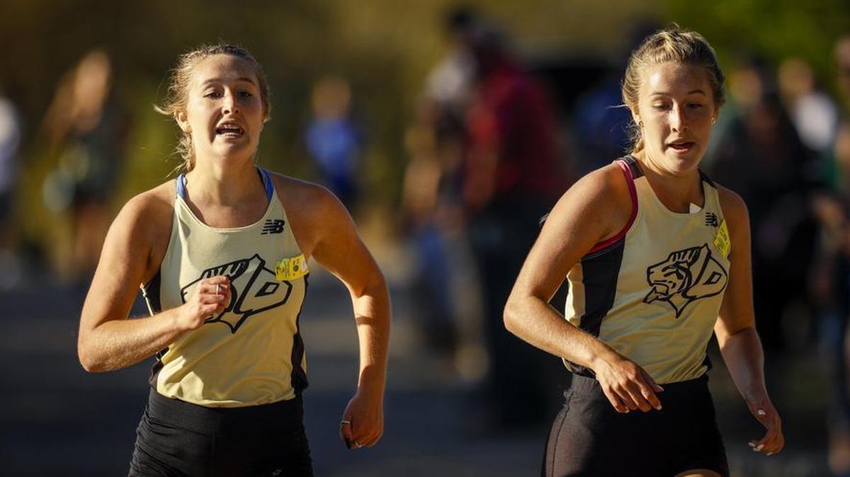 Alexis Lewis (right) narrowly beat her twin sister Eliza Lewis to win the San Luis Obispo County Cross Country County Championship at Laguna Lake Park.