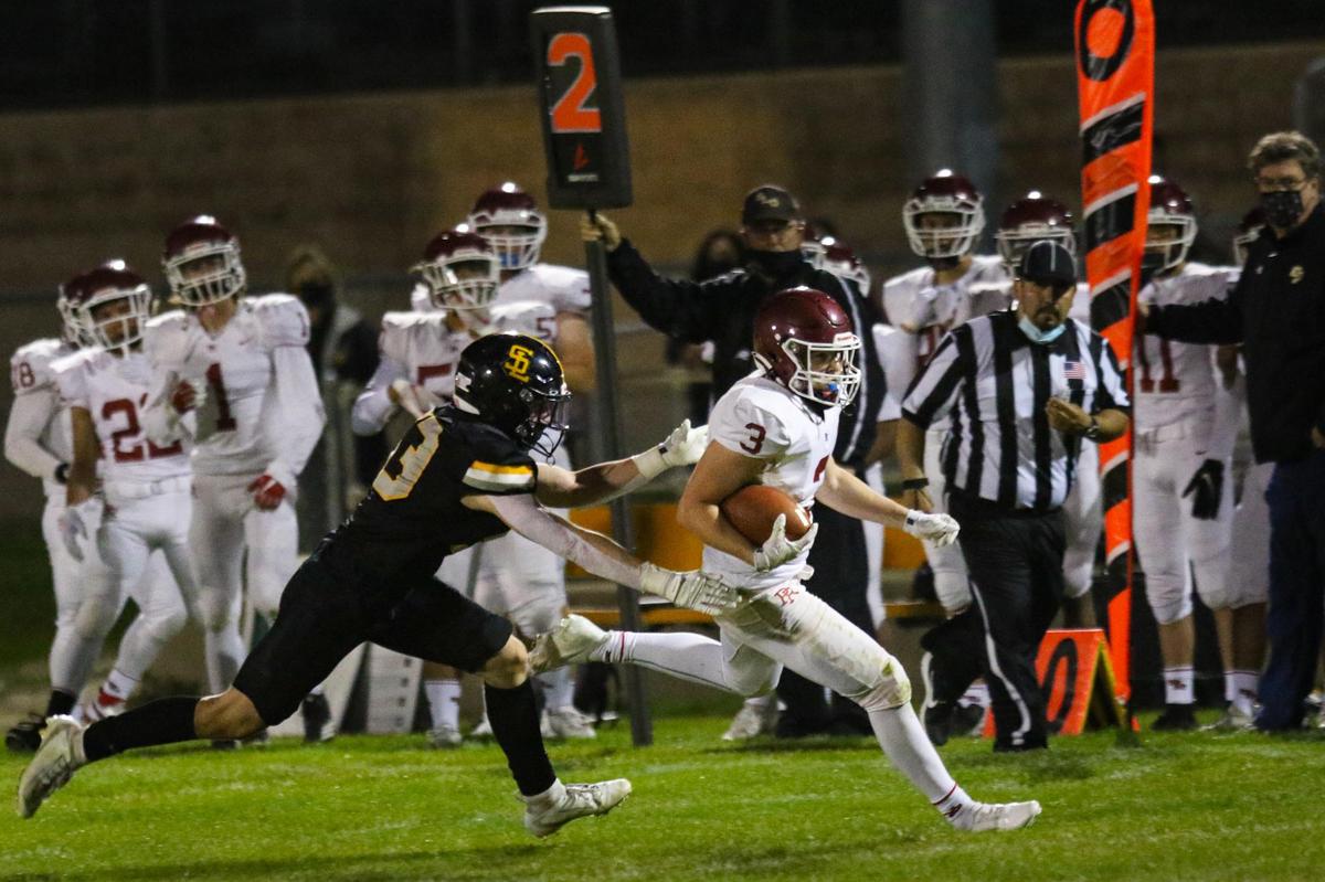Jake Morones runs for a first down as Luca Cuccaro attempts a tackle. San Luis Obispo hosted Paso Robles for the second game of the coronavirus shortened, late start to football season.