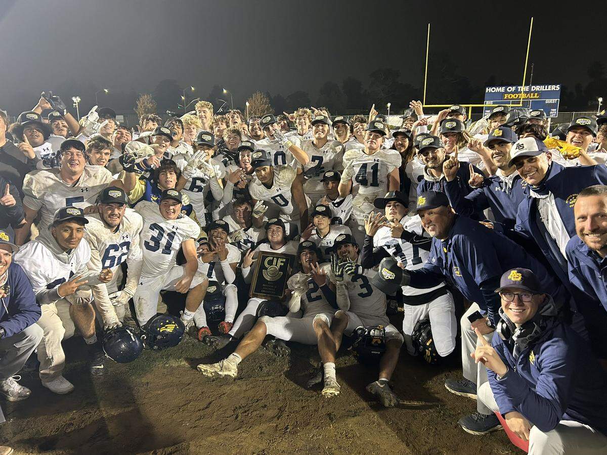 Arroyo Grande’s football team celebrates is 23-20 overtime win over Bakersfield in Division 2 CIF-Central Section playoffs.
