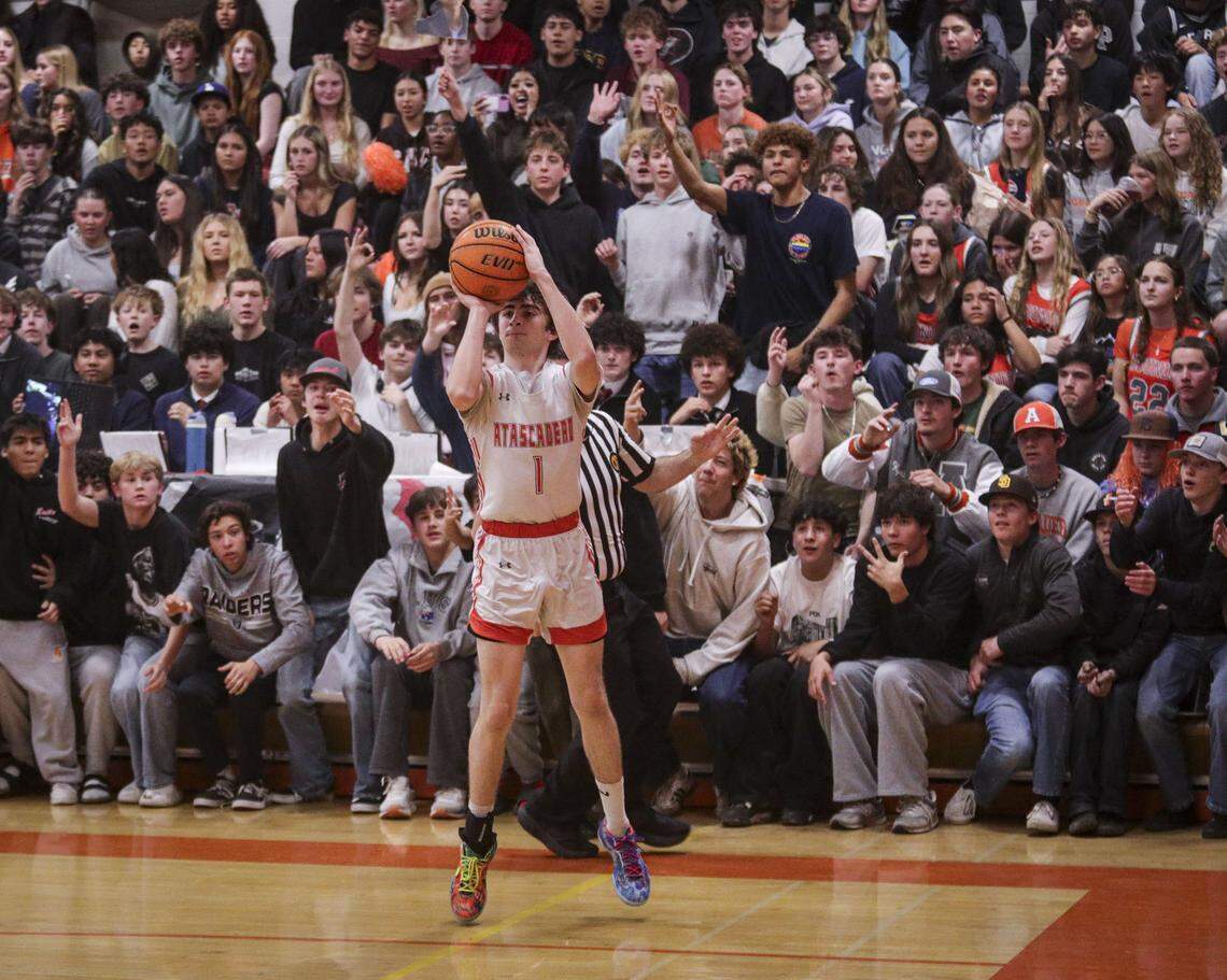 Steven Ernst shoots from behind the 3 point line. Atascadero beat Hoover 69-52 to advance to the final game in the Division II CIF Central Section Boys Basketball Championships.