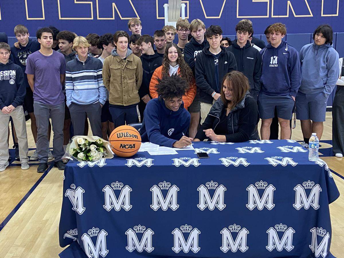 Mission Prep basketball star Jamar Howard and his mother, Jessica Smith, sign a letter of intent for Howard to play NCAA basketball at University of Texas Rio Grande Valley.