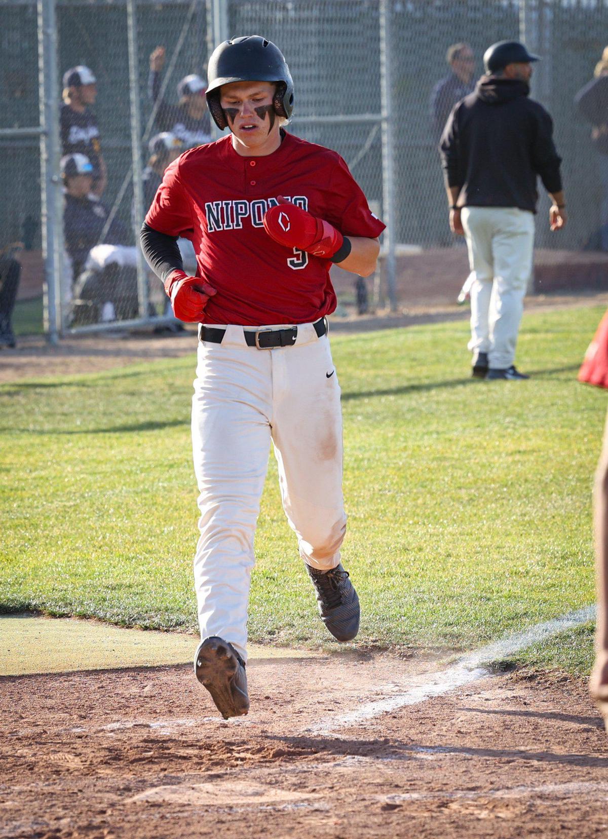 Nate Reese scores the Titan’s only run. Arroyo Grande won 12-1 over Nipomo May 17, 2022 in a baseball game at Arroyo Grande High School.