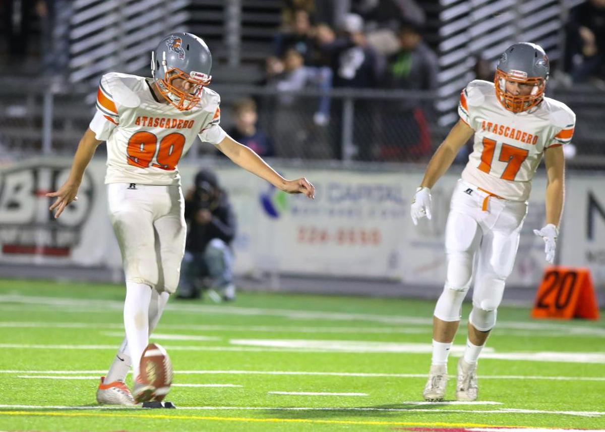 Ryan McLean kicks off. Paso Robles hosted Atascadero for the end of the year high school rivalry football game in 2019.