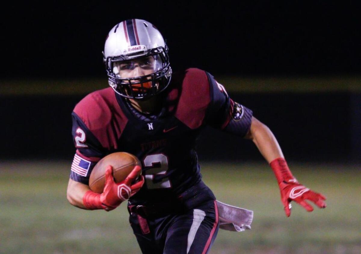 Nipomo’s JJ Ramirez carries the ball in a 2015 game against Mission College Prep.