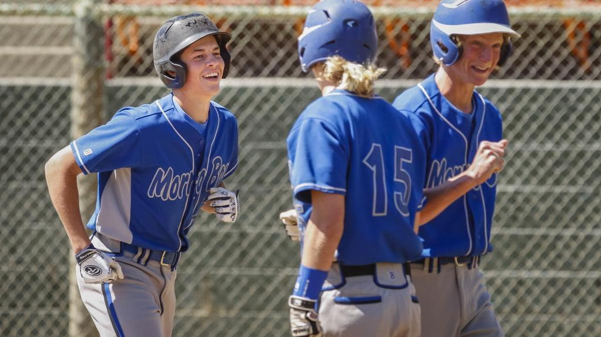 Morro Bay’s Joe Burton (left) celebrates with Orion Witmer (middle) and Tyler Chivens after a first inning home run.