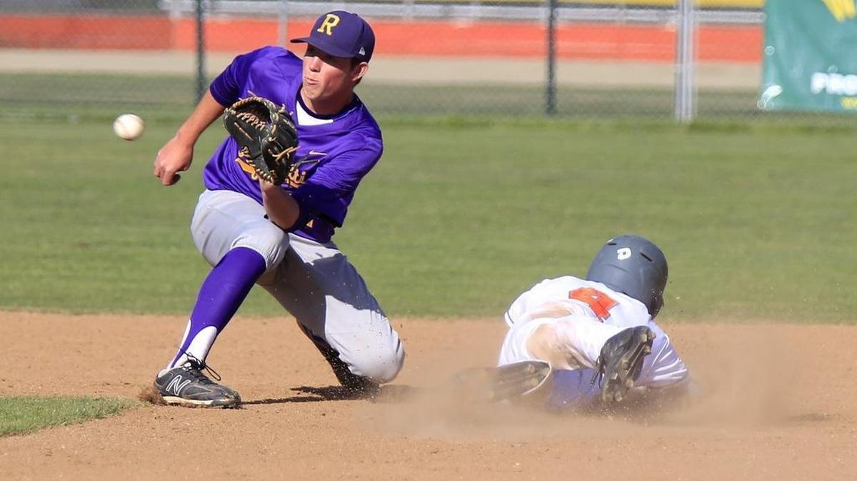 Righetti infielder Matthew Sauer (21) doesn’t get the ball in time as Atascadero’s Zach Javine (4) slides safely into second base on a force play during the Warriors’ 5-3 win over the Greyhounds on Friday.