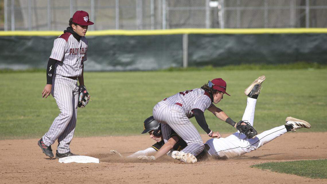 Talen Freitas was called for interference as he gets tangled with Casey Stephens at second base. Marcus Garcia watches at left. San Luis Obispo beat Paso Robles 5-4 in a high school baseball game April 23, 2026
