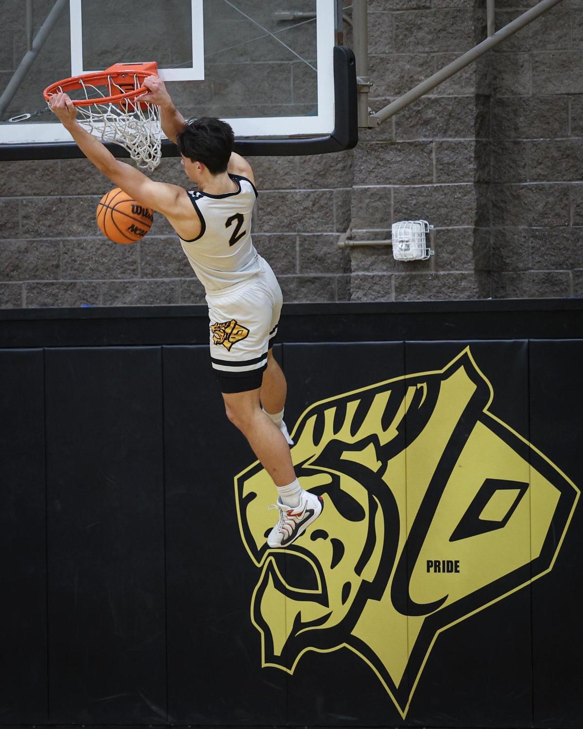 Jace Gomes with the second of two dunks after forcing turnovers. Atascadero High School beat San Luis Obispo 60-57 on Jan. 21, 2025.