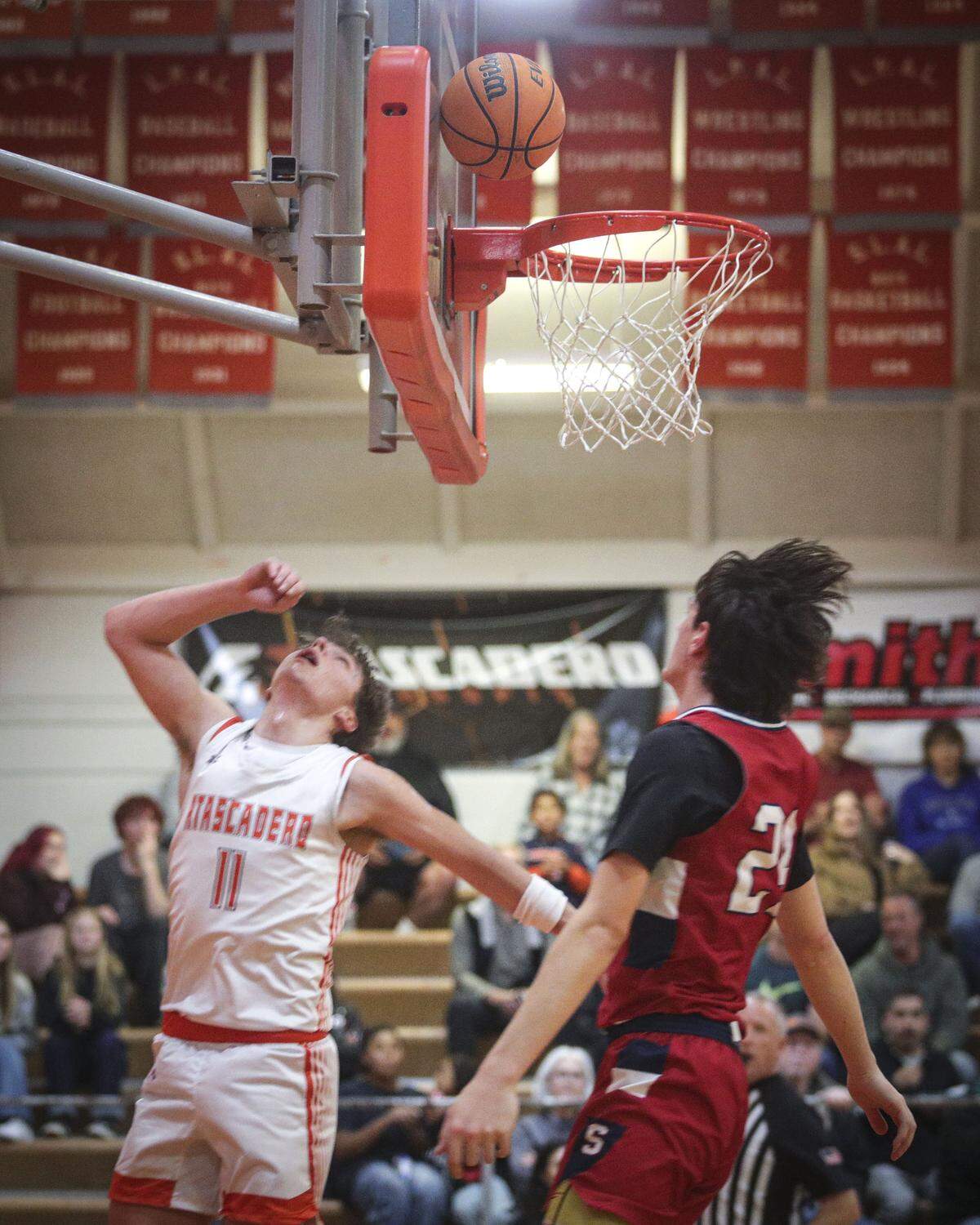 Timothy Kyle Foster puts up a layup defended by Jake Gartner. Atascadero beat Sanger 82-41 in a basketball playoff Feb. 17, 2026.