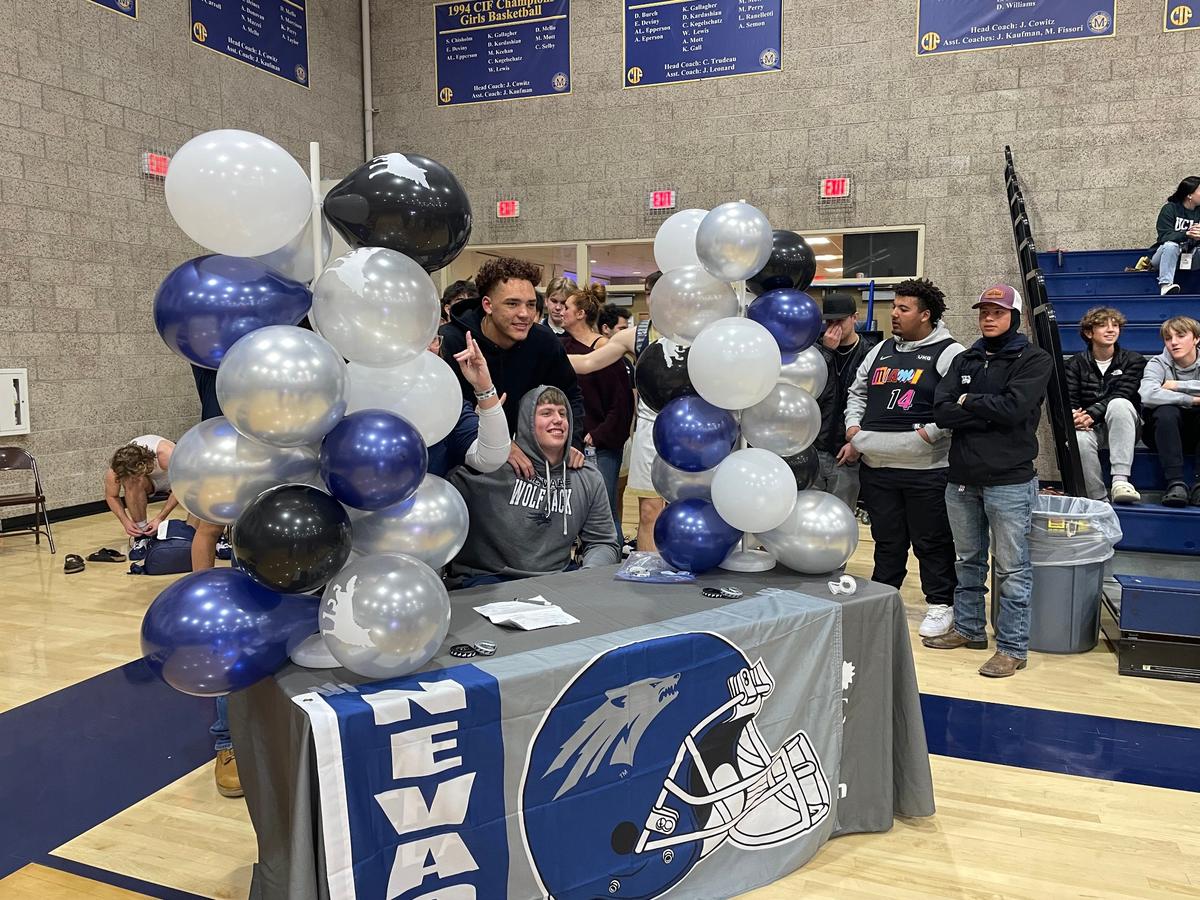 Mission Prep football player R.J. Esmon signs with the University of Nevada on Wednesday.