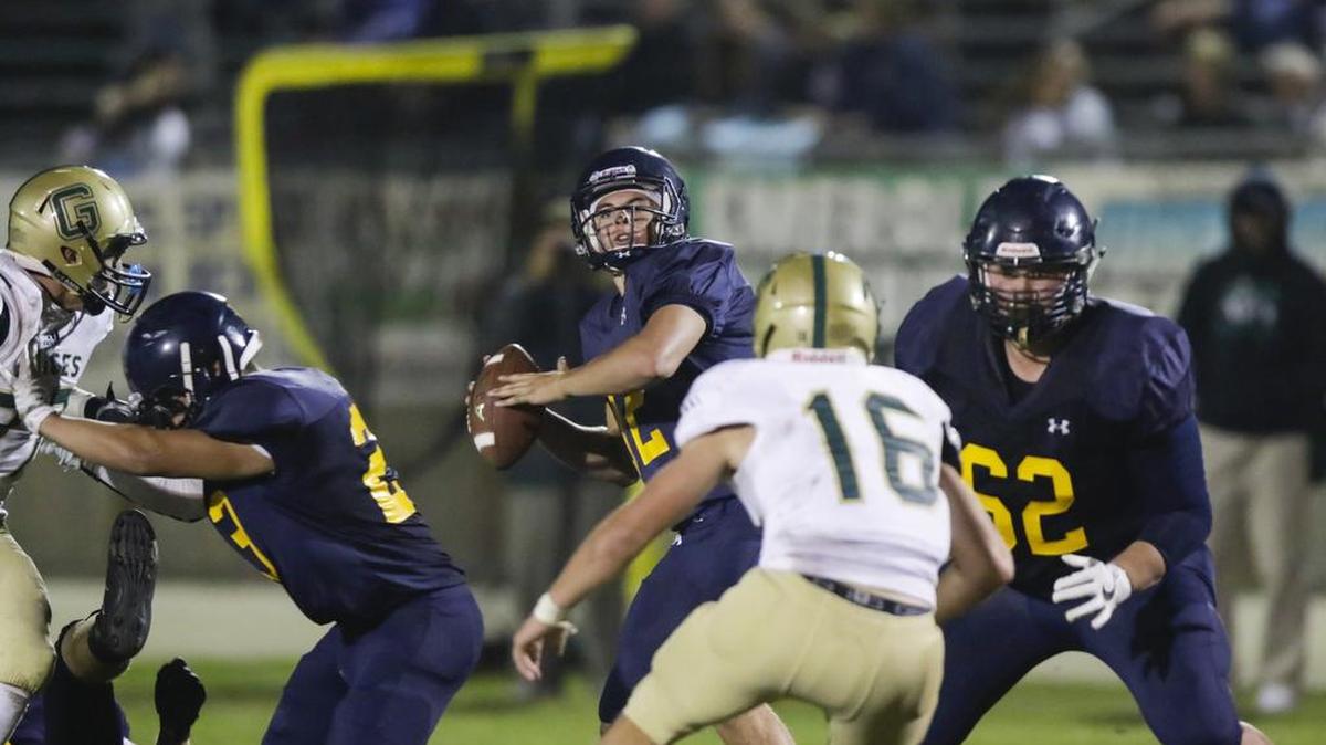 Sawyer May looks to throw for Arroyo Grande High football as it hosted Garces Memorial from Bakersfield in a non-league game. 9-2-2016 David Middlecamp