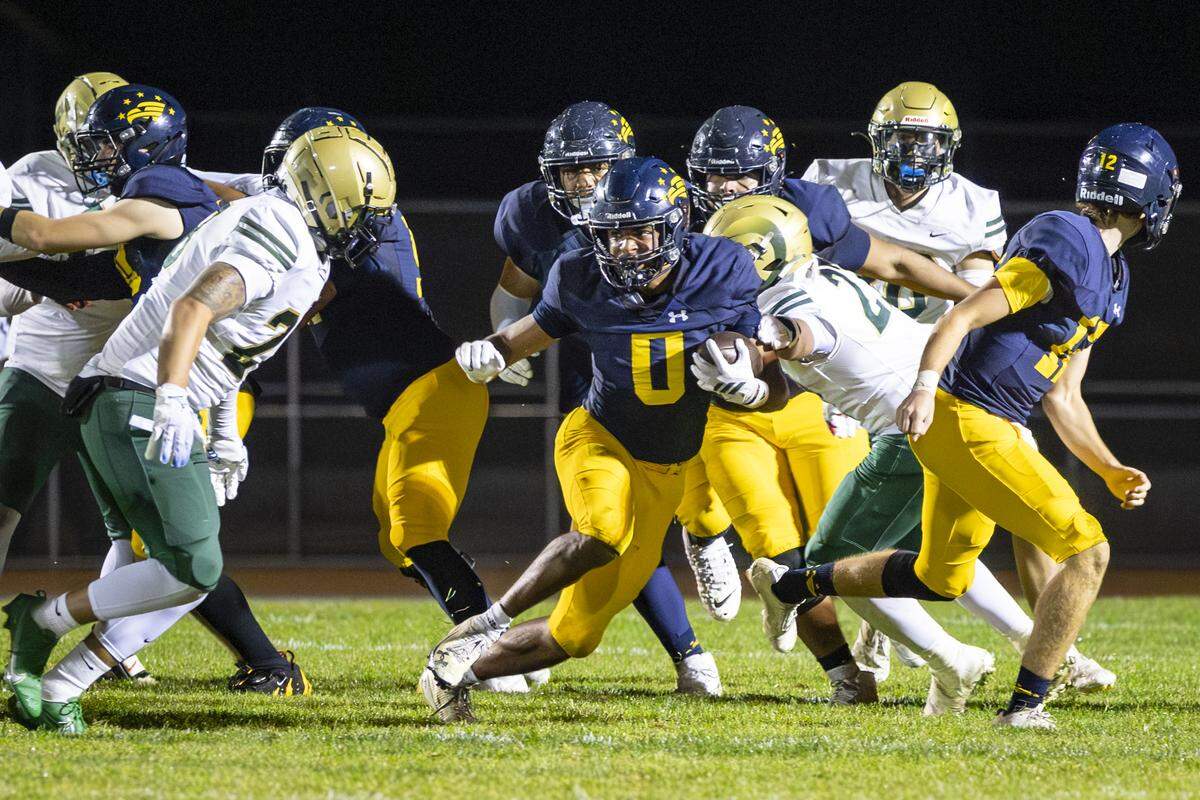Caleb Clark runs in Arroyo Grande’s 42-29 win over Garces Memorial.