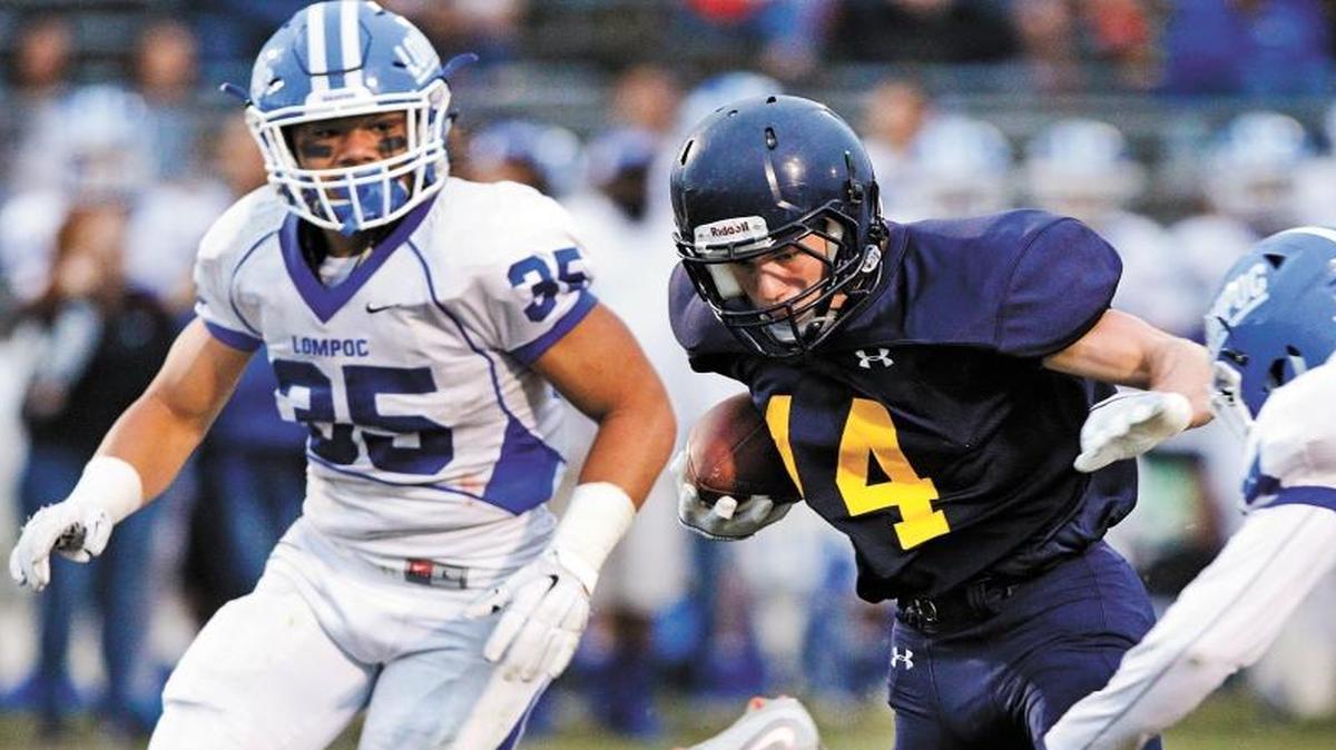 Lompoc star Toa Taua (left) tracks down Arroyo Grande's Matthew Sill during a 2015 game won by Arroyo Grande. Photo by Joe Johnston 08-28-15