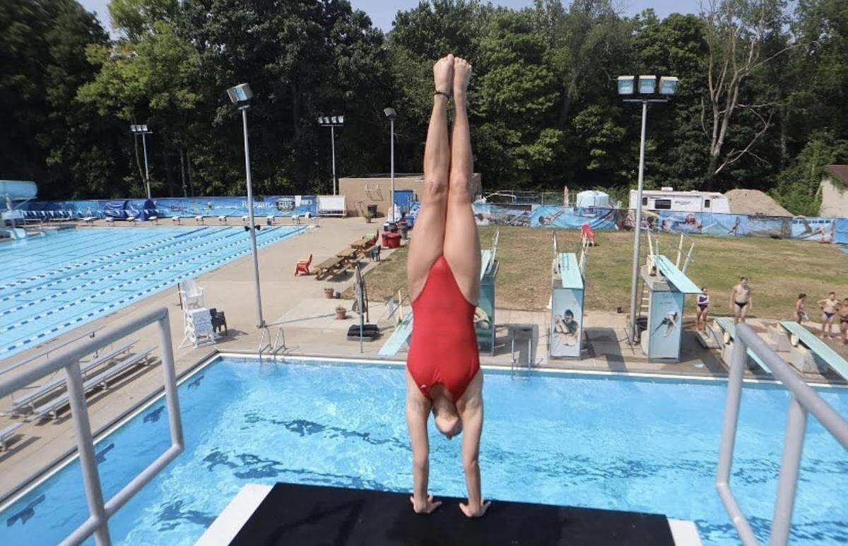 Malia Maire dives for San Luis Obispo High School. Maire, a senior, won the CIF-Central Section championship in Division 1 diving this season.
