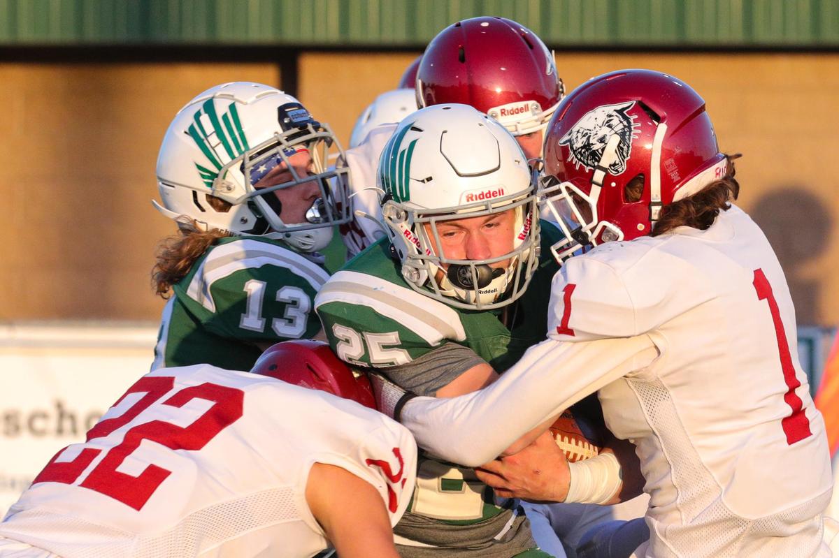 Templeton quarterback Tyler Kaschewski was the target of the Paso Robles defense, here #22 Niko Reys and others. Templeton hosted Paso Robles for the first matchup between the high schools in 97 years.
