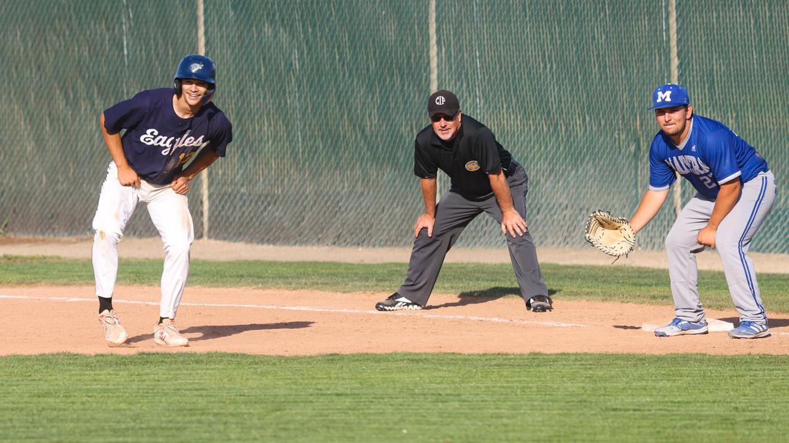Tyler Hamilton broke up the no-hit bid with a single, Nick Sweet holds him on. Arroyo Grande hosted Madera in the CIF Division 2-Central Section Championship.