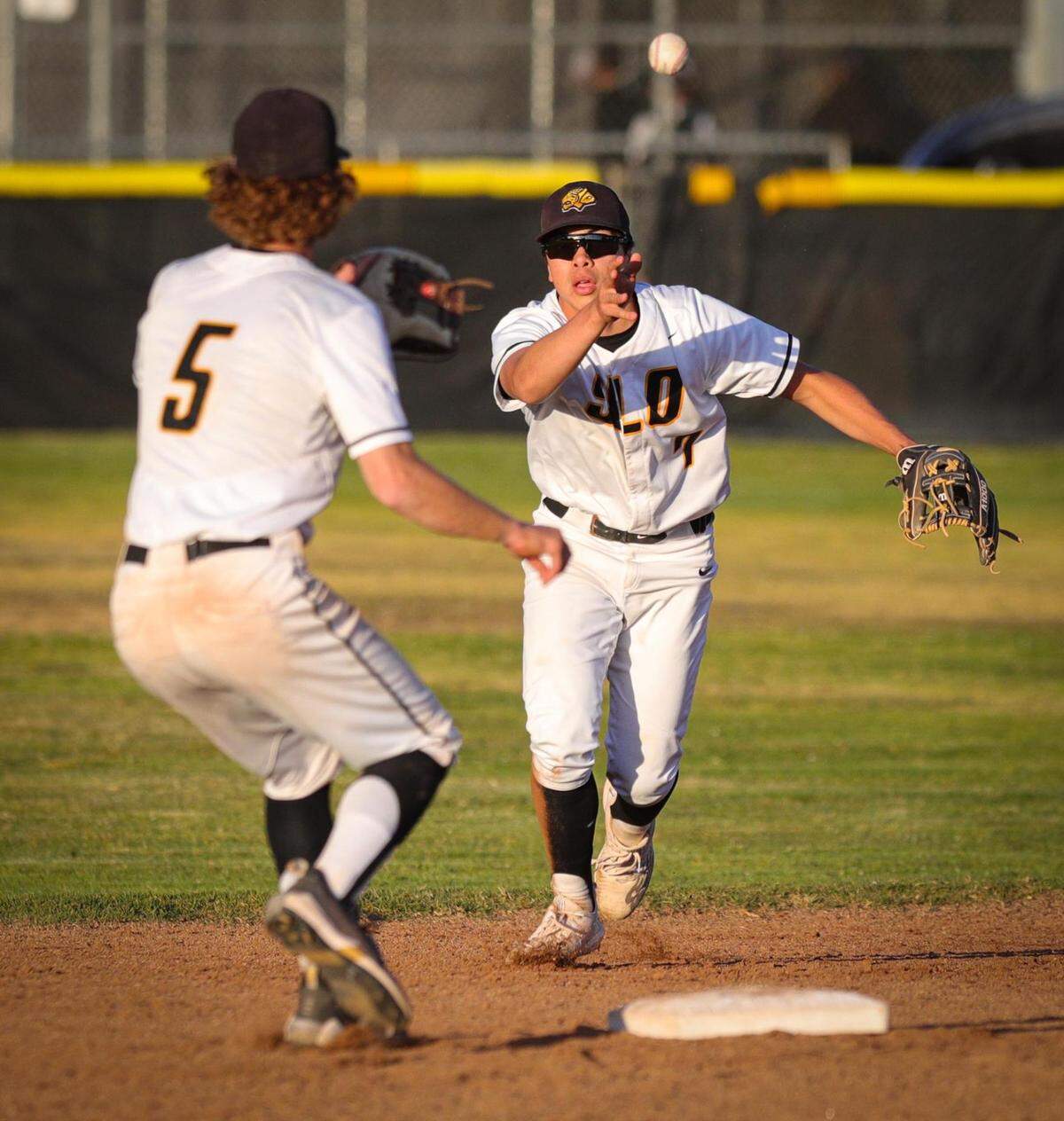 Owen Wells feeds Bo Victor the ball at second base for an out. San Luis Obispo won 3-1 over Arroyo Grande in a baseball game in SLO May 12, 2022.