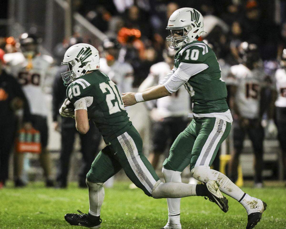 Colter Tannehill hands off to Tyler Cunningham. Templeton beat Coalinga 40-14 in a playoff football game Nov. 14, 2025.