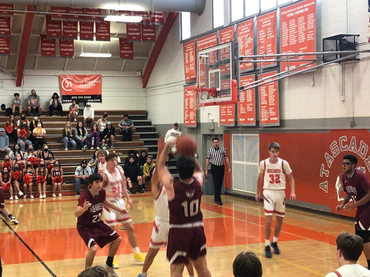 Jacob Lambeth lets go on a 3-pointer for Paso Robles 