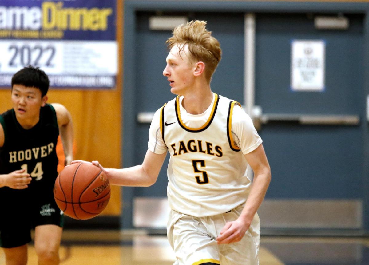 Arroyo Grande’s boys basketball team lost to Hoover of Fresno 68-63 in a first-round 2022 CIF-Central playoff game. Brody Naber (5) dribbles in the second half.