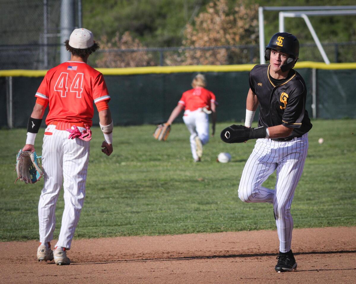 Landon Drenckpohl heads for third and was waved home scoring the go ahead run. In a game that saw sparkling plays on defense and good pitching, San Luis Obispo beat Atascadero 2-1 on April 3, 2025.
