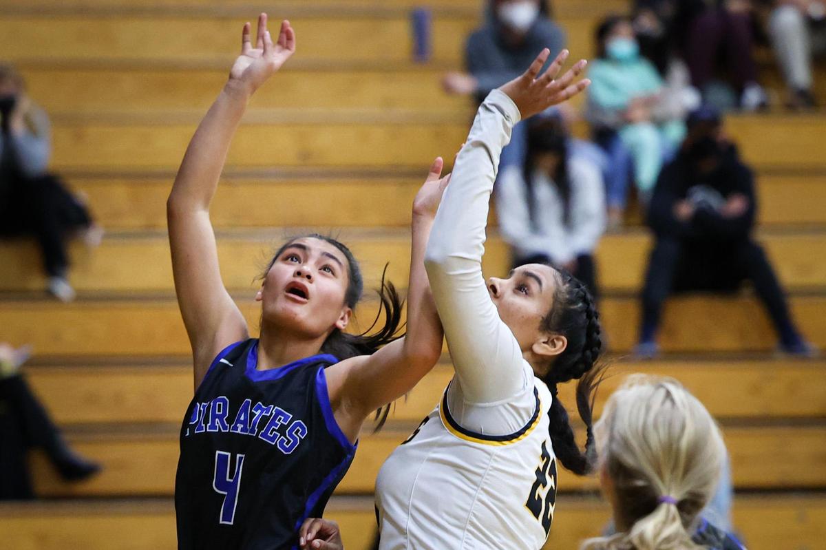 Ashley Magday of Morro Bay contents for a rebound with Jaspawan Kaur of SLO as Morro Bay won over San Luis Obispo 39-25 on Feb. 4, 2022.