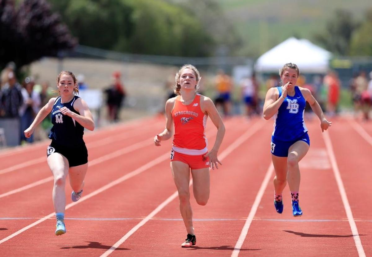 Brittany McKinley, Atascadero HS, wins the women’s varsity 100-meter dash at 12:44 at the SLO County Meet. She said it was her best personal record. (Laura Dickinson)