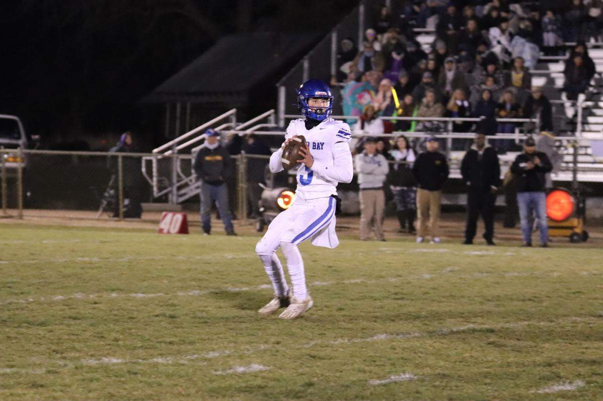Morro Bay’s Nicky Johnson drops back for a pass.